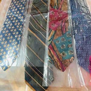 Brand new ties in plastic